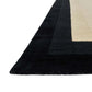 Black & cream framed rug close up